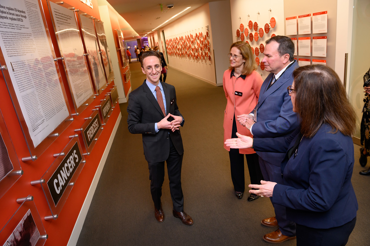 Jonathan previewing an installation featuring Jos&eacute; Baselga's influential medical publications, with Silvia Baselga-Garriga and AACR leadership